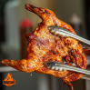 Frango assado na brasa ( Acompanha batata miúda e farofa)