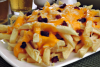 INTEIRA PORÇÃO DE BATATA COM CHEDDAR E BACON 